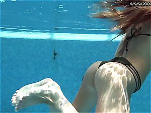 Tiffany Tatum unwraps bare underwater